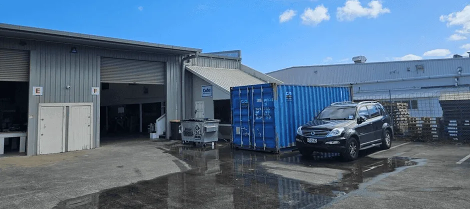 Industrial warehouse concrete grinding and epoxy preparation in Wiri